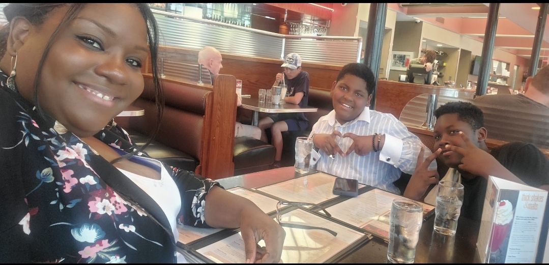 A shared meal and a smiling snapshot with Erica during the Des Moines Art Week outing.