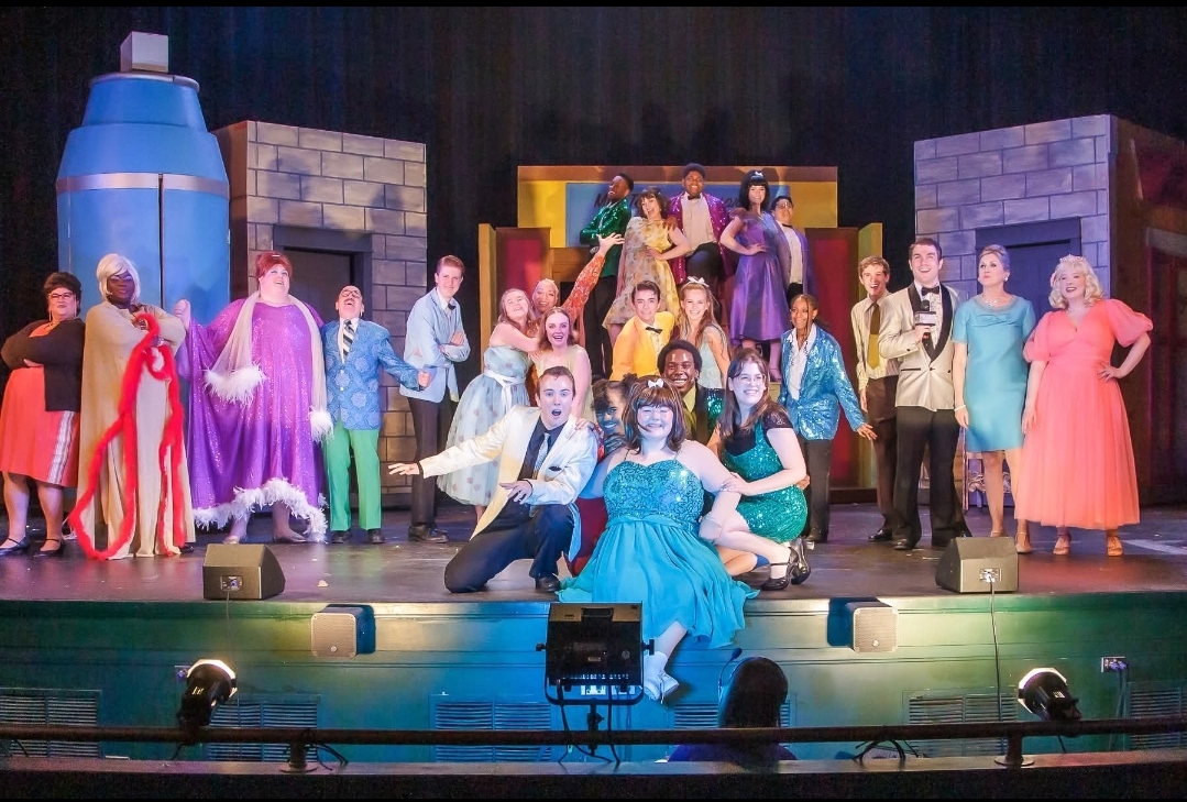 A cast portrait celebrates the people behind the production. Beyond each performance are rehearsals, collaboration, and the commitment it takes to bring a show to an audience.