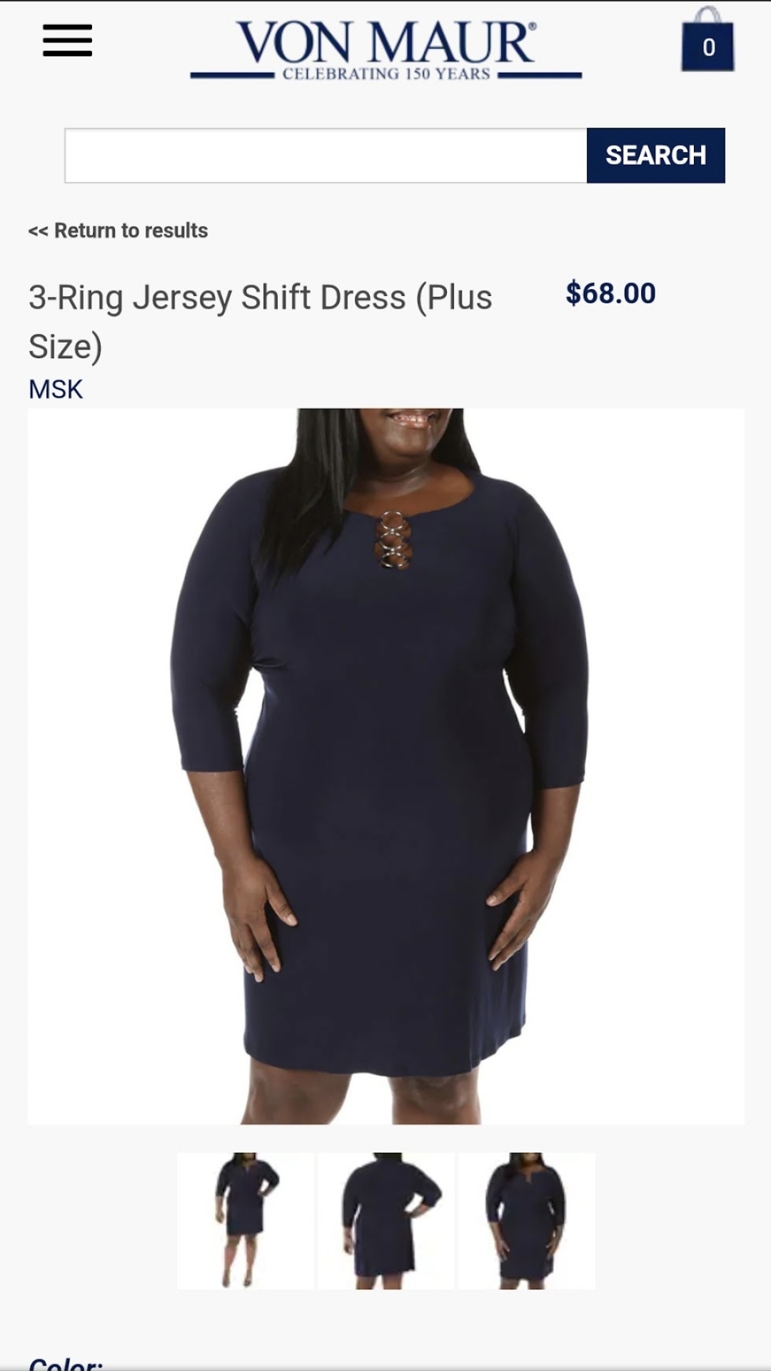 A navy jersey dress offers another view of Erica’s retail work, emphasizing the dress’s shape through a straightforward, expressive pose.